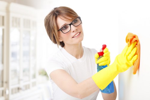 Cleaner using safe working practices during a property visit