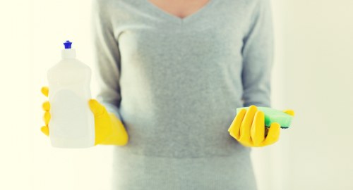 Technician reviewing cleaning product safety instructions