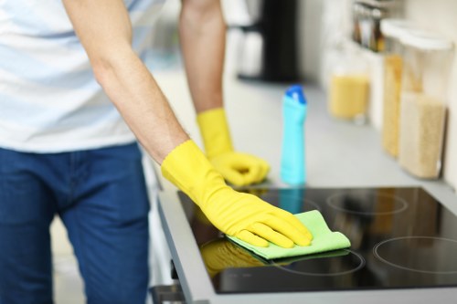 Carpet cleaning team member working with protective gear and equipment